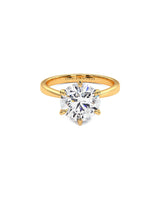 This Lab Grown Diamond Ring Features A 3 Carat Round Shape Center Lab Grown Diamond In G-H Color, VS2 Clarity. This Ring Is In 14 Karat Yellow Gold.